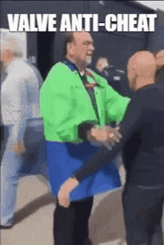A Man In A Green Jacket Is Shaking Hands With Another Man In A Black Shirt . GIF