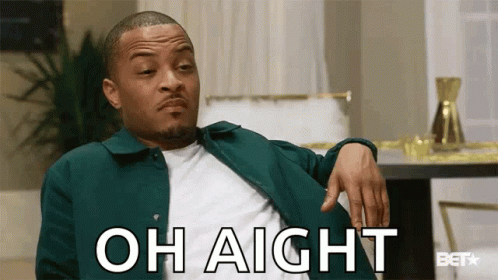 A Man In A Green Jacket Is Sitting In A Living Room With His Hand On His Knee And Says Oh Aight . GIF