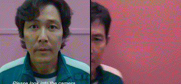 A Man In A Green Jacket Is Standing In Front Of A Pink Wall And Looking At The Camera . GIF