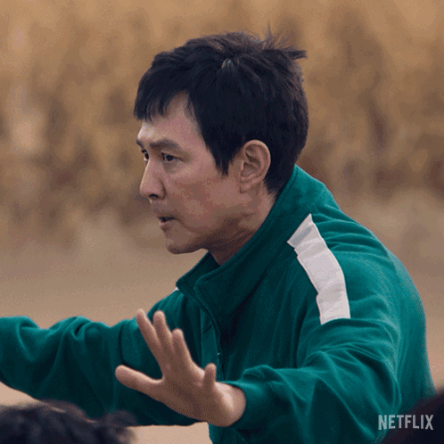 A Man In A Green Jacket With Netflix Written On The Bottom Of The Screen GIF