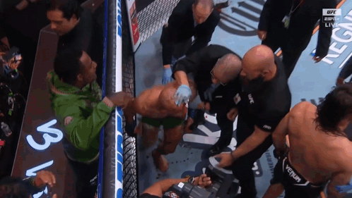 A Man In A Green Jacket With The Word Ufc On His Back GIF