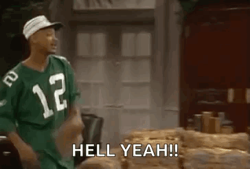 A Man In A Green Jersey Is Standing Next To A Pile Of Logs And Says `` Hell Yeah ! '' GIF