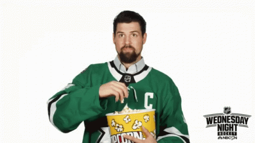 a man in a green jersey with the letter c on it