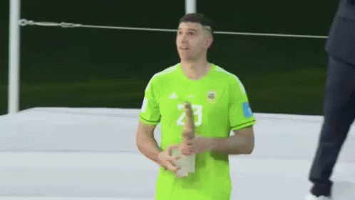 A Man In A Green Jersey With The Number 2 On His Shorts GIF