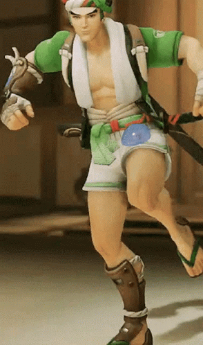 A Man In A Green Shirt And White Shorts Is Running With A Sword GIF