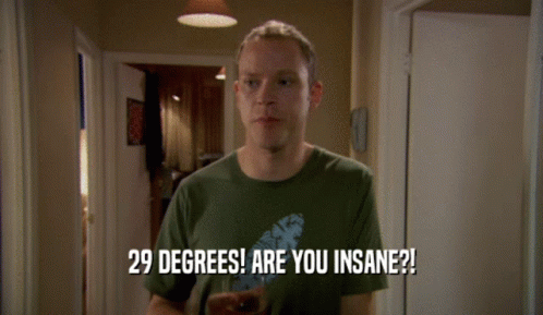 A Man In A Green Shirt Holds A Glass Of Beer And Says 29 Degrees Are You Insane GIF