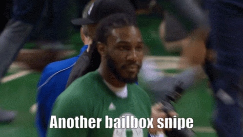 A Man In A Green Shirt Holds A Microphone And Says " Another Bailbox Snipe " GIF