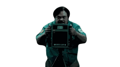 a man in a green shirt is holding a camera that says westland