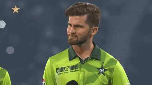 A Man In A Green Shirt That Says ' Champions Trophy 2020 ' On It GIF