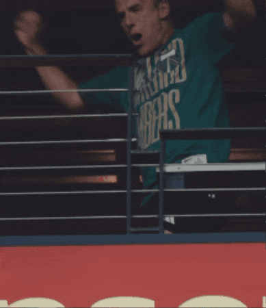 A Man In A Green Shirt That Says ' Washington ' On It GIF