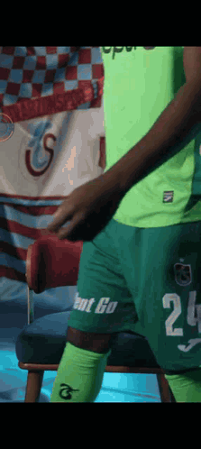 A Man In A Green Shirt With The Number 25 On It GIF