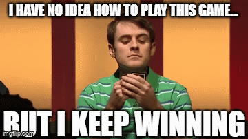 A Man In A Green Striped Shirt Is Holding A Card And Says I Have No Idea How To Play This Game . GIF