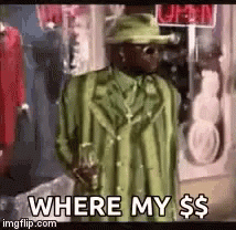 A Man In A Green Suit And Hat Is Standing In Front Of A Store And Asking Where My Money Is . GIF