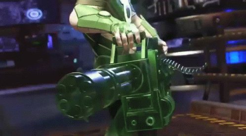 A Man In A Green Suit Is Standing In A Room With A Gun . GIF