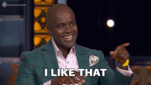 A Man In A Green Suit Says " I Like That " While Pointing GIF