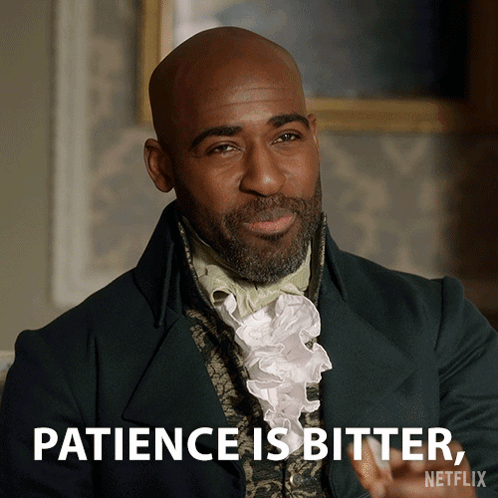 A Man In A Green Suit Says Patience Is Bitter On Netflix GIF