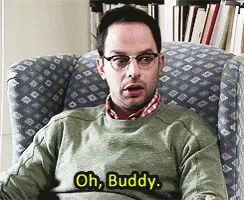 A Man In A Green Sweater Is Sitting In A Chair And Saying Oh Buddy GIF