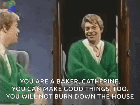 A Man In A Green Sweater Is Talking To Another Man In A Green Sweater . GIF