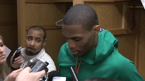 Man In Green Sweatshirt Being Interviewed GIF