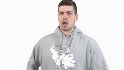 A Man In A Grey Hoodie Is Making A Gesture GIF