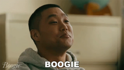 A Man In A Grey Hoodie Says Boogie In Front Of Him GIF