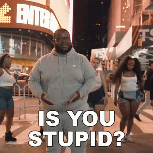 A Man In A Grey Nike Sweatshirt Stands In Front Of A Sign That Says ' Entba ' GIF