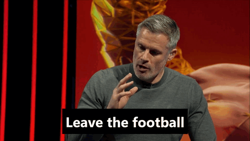 A Man In A Grey Sweater Is Speaking Into A Microphone With The Words " Leave The Football " Behind Him GIF