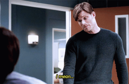 Man In Grey Sweater Saying I Mean To Another Man GIF