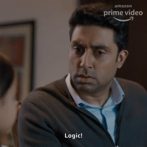 A Man In A Grey Sweater Says Logic In Front Of An Amazon Prime Video Advertisement GIF