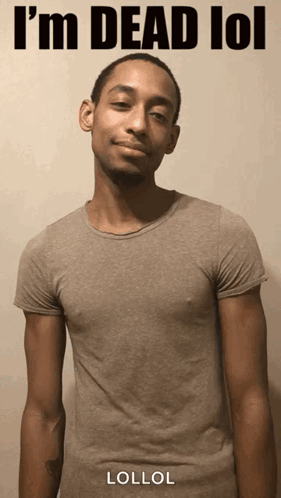 A Man In A Grey T-Shirt With The Words I 'M Dead Lol On It GIF
