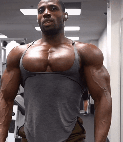 Man In Grey Tank Top With Large Chest GIF