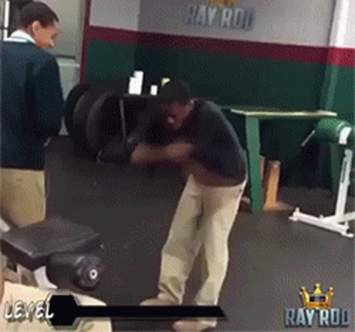 A Man In A Gym With The Word Ray Rod On The Bottom GIF