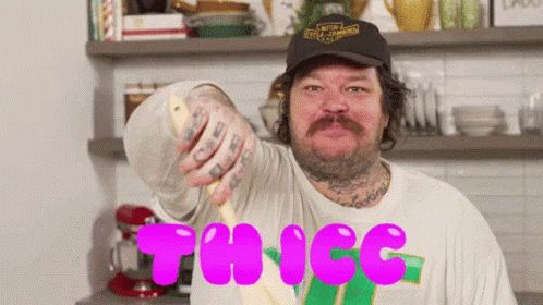 A Man In A Harley Davidson Hat Is Holding A Spoon In His Hand GIF