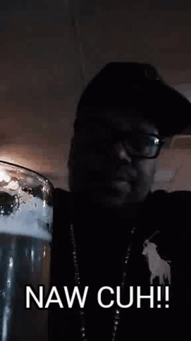 A Man In A Hat And Glasses Is Holding A Glass Of Beer And Says Naw Cuh ! GIF