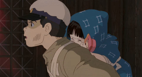 A Man In A Hat Is Carrying A Girl In A Blue Scarf On His Back GIF