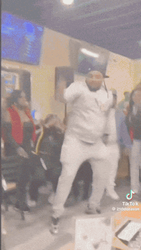 Man In Hat Dancing In Front Of Crowd GIF