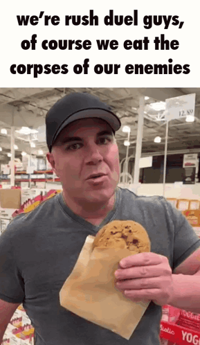 A Man In A Hat Is Holding A Cookie In A Paper Bag And Says We 'Re Rush Duel Guys GIF