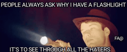 A Man In A Hat Is Holding A Flashlight And Says People Always Ask Why I Have A Flashlight . GIF