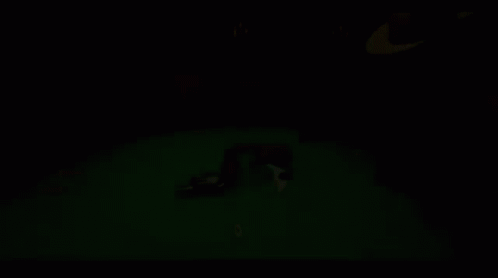 A Man In A Hat Is Playing Poker With A Gun On The Table GIF
