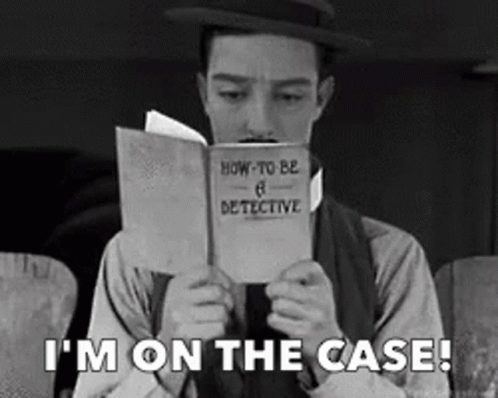 A Man In A Hat Is Reading A Book About How To Be A Detective GIF