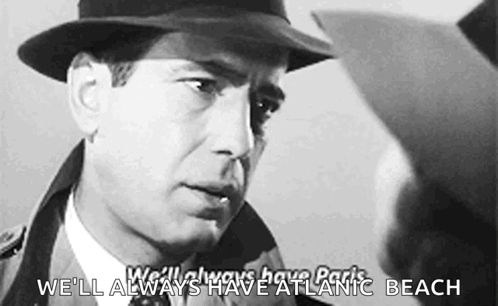a man in a hat is talking to another man with the words we 'll always have atlantic beach below him