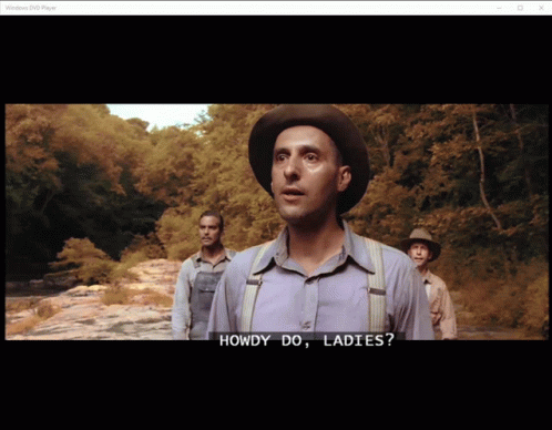 A Man In A Hat Says Howdy Do Ladies In Front Of Two Other Men GIF
