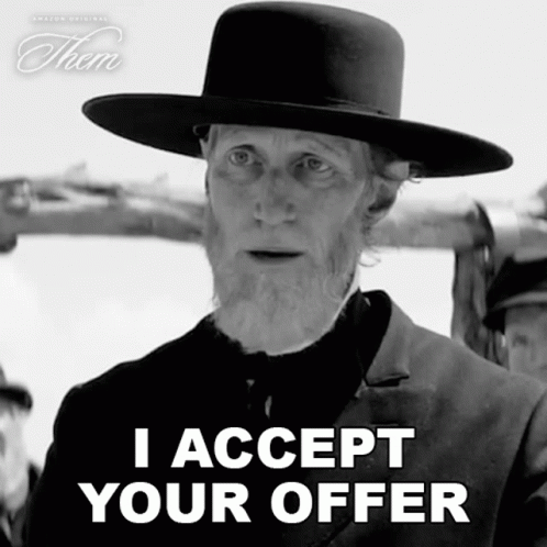 A Man In A Hat Says " I Accept Your Offer " In A Black And White Photo GIF