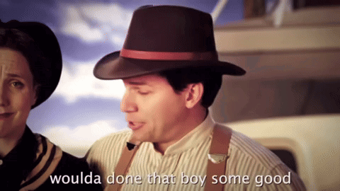 A Man In A Hat Says " Woulda Done That Boy Some Good " Next To A Woman GIF