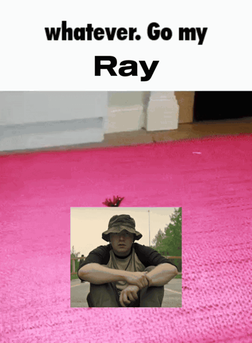 A Man In A Hat Sits On A Pink Rug With The Words " Whatever Go My Ray " Below Him GIF