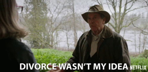 A Man In A Hat Talks To A Woman With The Words Divorce Wasn 'T My Idea GIF