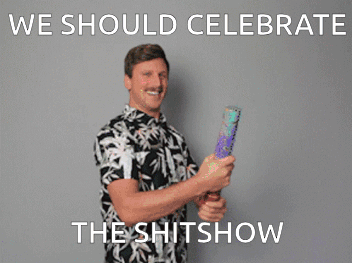 A Man In A Hawaiian Shirt Is Holding A Soap Bubble Gun And Says We Should Celebrate The Shitshow . GIF