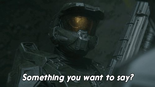 A Man In A Helmet Is Holding A Gun And Asking Something You Want To Say GIF