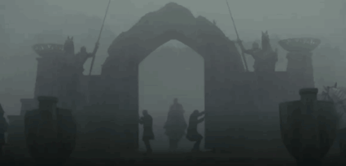 A Man In A Helmet Is Standing Next To Another Man In A Black Suit . GIF