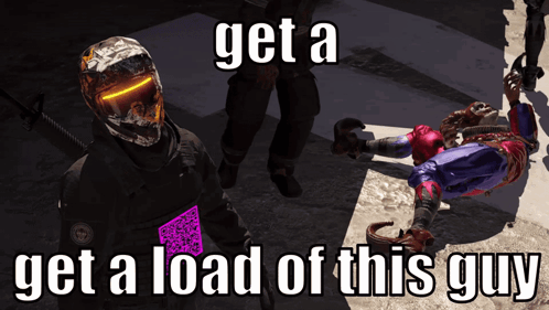 A Man In A Helmet Stands Next To A Man Laying On The Ground With The Words Get A Load Of This Guy Written Below Him GIF